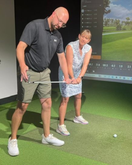 Harry Mayers coaching a golfer at Churston